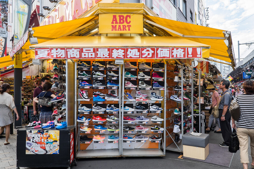 TOKYO, JAPAN - CIRCA August, 2014: Nike branded sneakers on display in Ueno street. Ueno street is a shopping center in Tokyo lined with brand names.