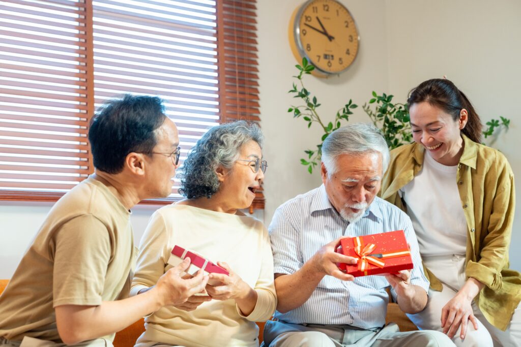 Asian grandparents with gifts